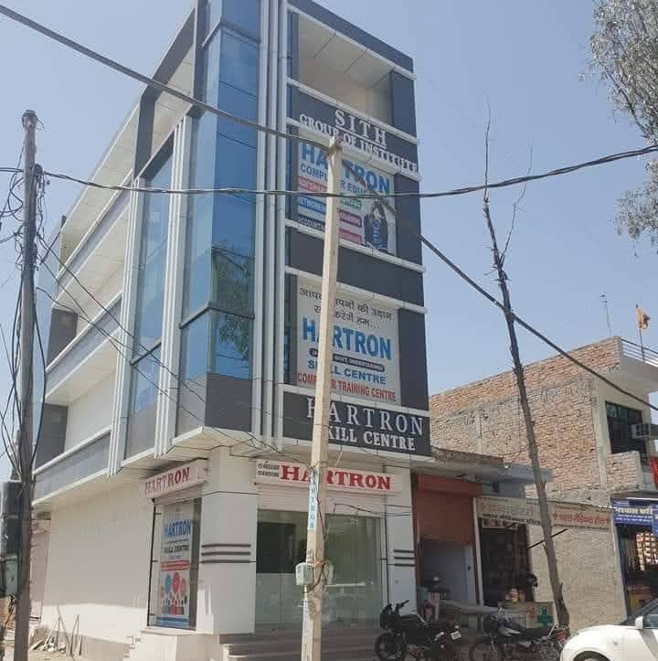 a building with glass walls and windows